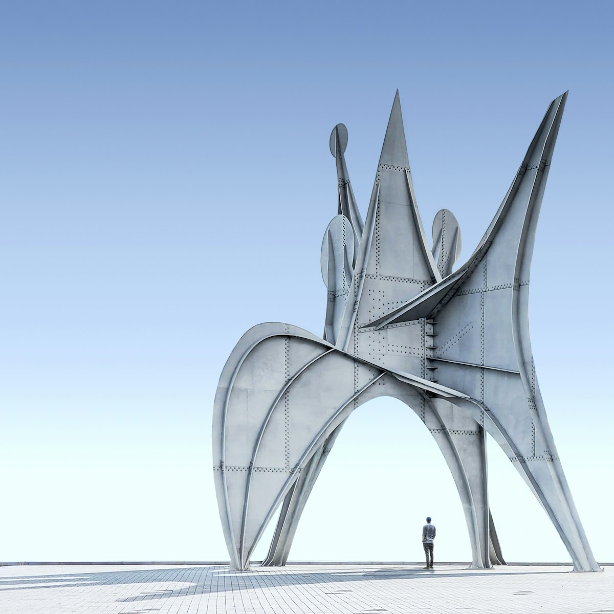 a person standing in front of a large structure