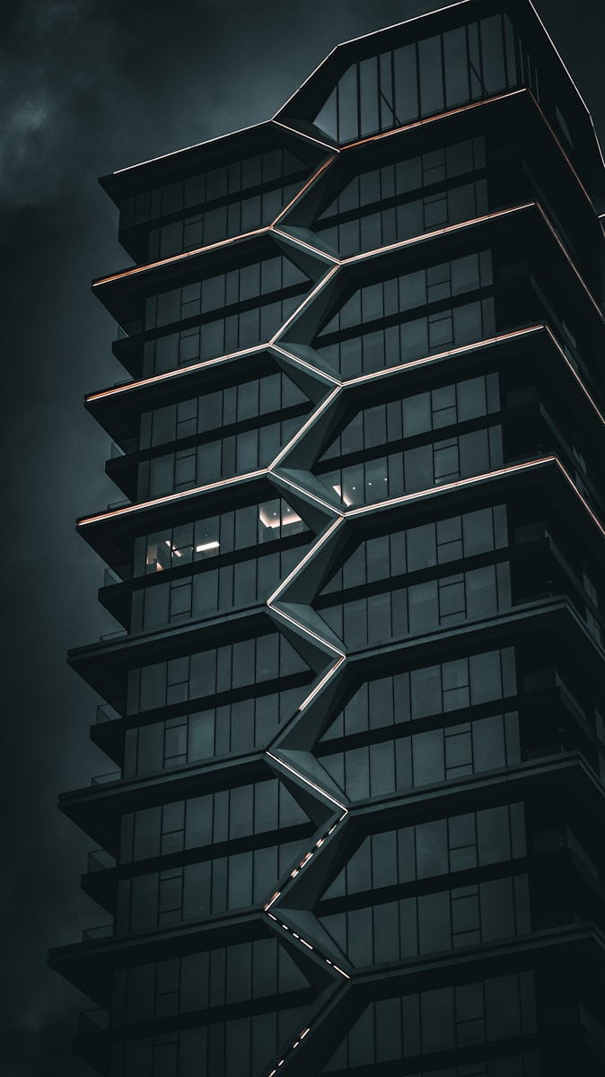 a tall building with a spiral design on the side